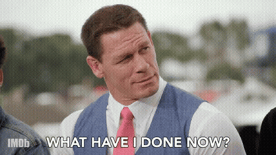 john cena is wearing a suit and tie and asking what have i done now ?