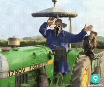 John Deere Tractor With Scarecrow GIF