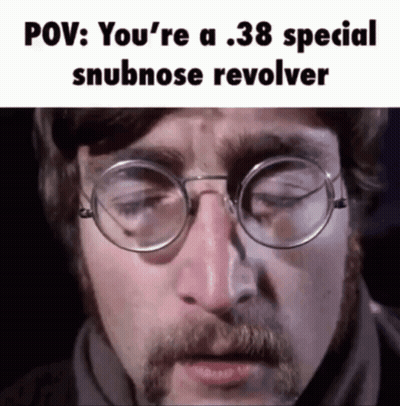 John Lennon Singing Into Mic While Eating Apple GIF