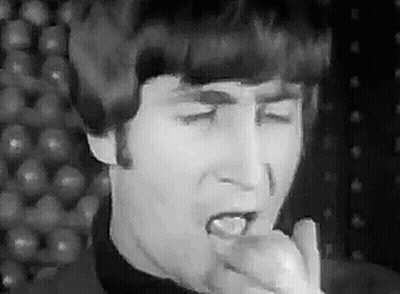 John Lennon Singing Into Microphone Eating Apple GIF