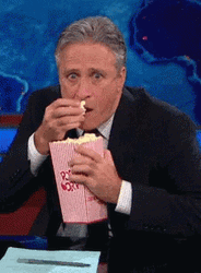 John Stewart Eating Popcorn