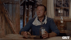 John Wayne Overturns Table GIF