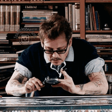 Johnny Depp Searching Using Magnifying Glass GIF
