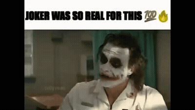 Joker In White Shirt Making Funny Face At Table GIF