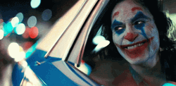 Joker Laughing At The Cab Going Home GIF