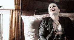 Joker Laughing Lying In His Bed GIF