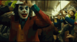 Joker Laughing People Wearing Same Masks GIF