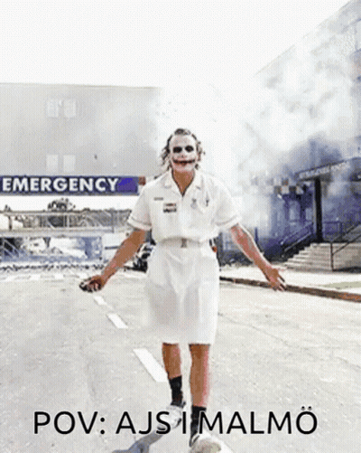 Joker Nurse Walking Past Emergency Sign GIF