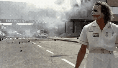Joker Standing In Front Of Emergency Room GIF