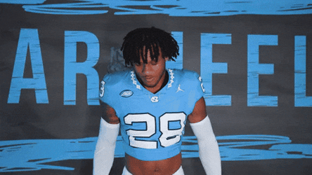 Jolly Athlete Performing Heisman Pose GIF