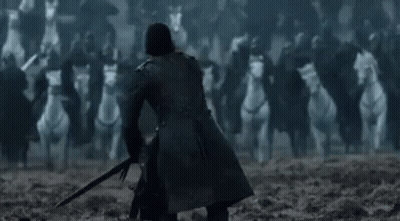 Jon Snow Is Holding A Sword In Front Of A Huge Army Of Horses . GIF