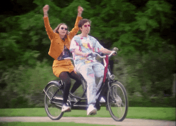 Joyful Biking Duo GIF