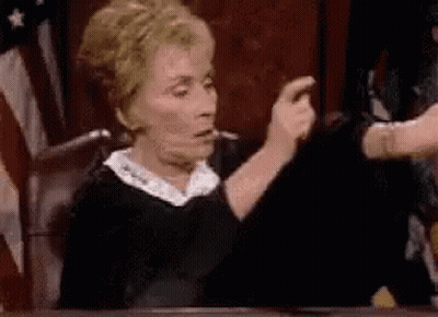 Judge Giving Thumbs Up In Front Of American Flag GIF