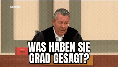 Judge In Robe Sitting In Front Of Book GIF