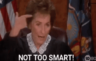 Judge Pointing At Head In Front Of American Flag GIF