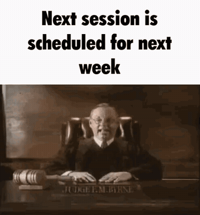 Judge Sitting At Desk With Gavel And Nameplate GIF