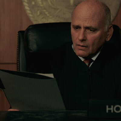 Judge Sitting At Desk With HC Name Plate GIF