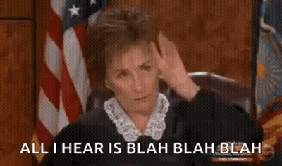 Judge Sitting In Front Of American Flag GIF