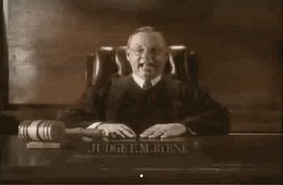 Judge Smiling At Desk GIF