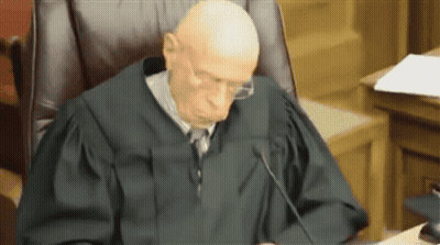 Judge With Glasses In Courtroom GIF