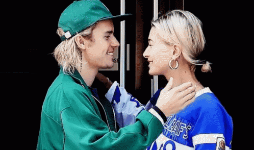 Justin Bieber And Hailey Baldwin Are Looking At Each Other And Smiling . GIF