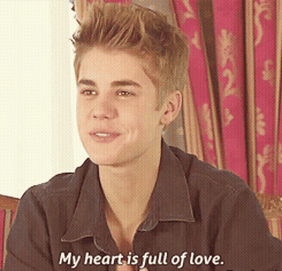 Justin Bieber Is Smiling And Saying " My Heart Is Full Of Love " GIF