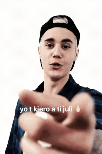 Justin Bieber Is Wearing A Black Hat And Plaid Shirt And Pointing GIF