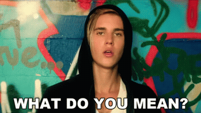 Justin Bieber Is Wearing A Hooded Jacket And Asking What Do You Mean GIF