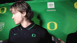 Justin Herbert Ducks Hair Flip GIF