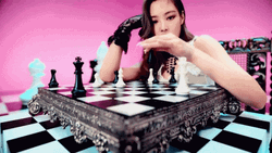 K-Pop Jennie Kim Knocking Down Chess Piece GIF