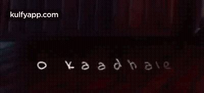 Kaadhale Written In White On Dark Background GIF