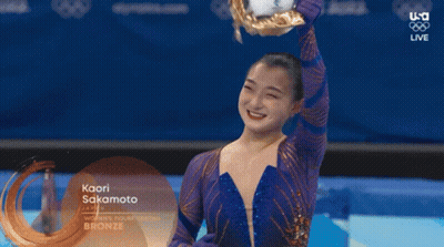 Kaori Sakamoto Is Holding A Trophy In Her Hand GIF