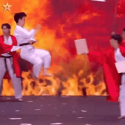 Karate Fighters Performing In Front Of Flames GIF
