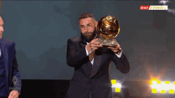 Karim Benzema Holding Trophy In Tux GIF
