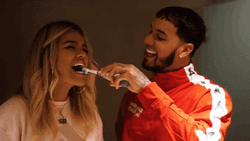 Karol G Brushes Teeth With Someone GIF