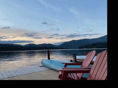 Kayak On Dock Next To Chairs GIF