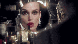 Keira Knightley Putting Chanel Lipstick