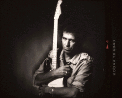 Keith Richards Cuddling Guitar Album Cover GIF