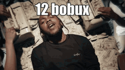Kendrick Lamar Lying On Millions Of Cash GIF