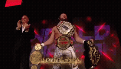 Kenny Omega Holding Two Championship Belts GIF