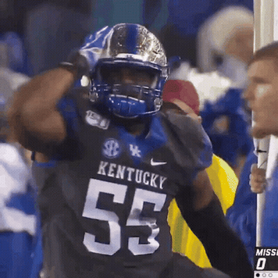 Kentucky Football Player Wearing Helmet And Gloves GIF