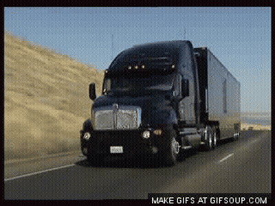 Kenworth Semi Truck Driving Down Highway GIF