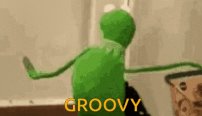 Kermit The Frog Is Dancing In A Room With The Words `` Groovy '' Written On The Bottom . GIF