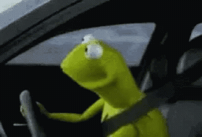 Kermit The Frog Is Driving A Car With A Seat Belt Around His Neck . GIF