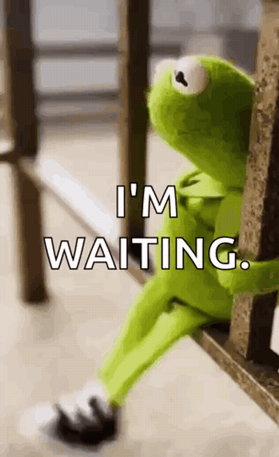 Kermit The Frog Is Sitting On A Bench With The Words `` I 'M Waiting '' Written Above Him . GIF