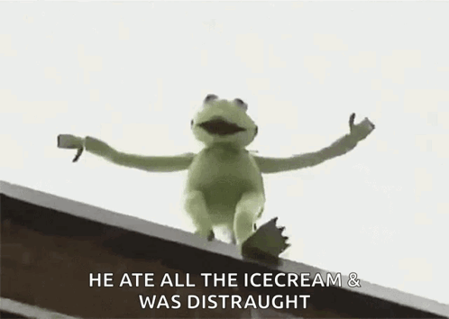 Kermit The Frog Is Sitting On Top Of A Building . GIF
