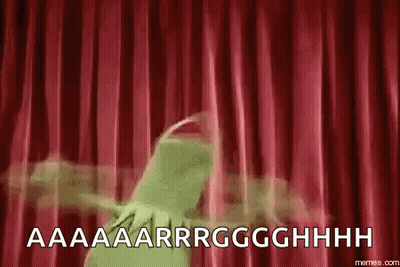 Kermit The Frog Is Standing In Front Of A Red Curtain And Screaming . GIF