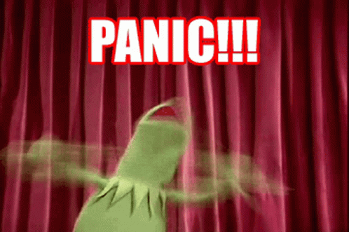 Kermit The Frog Is Standing In Front Of A Red Curtain With The Words Panic Written On It GIF