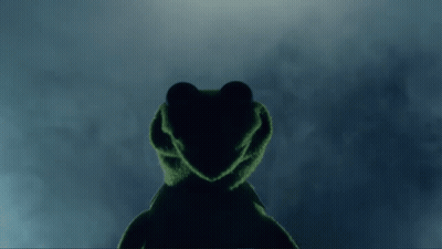 Kermit The Frog Is Standing In The Dark With A Heart Shaped Face GIF