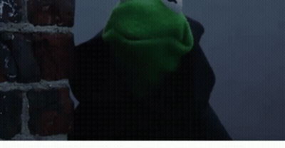 Kermit The Frog Is Standing Next To A Brick Wall With The Words It 'S Not Easy Being Mean Below Him GIF